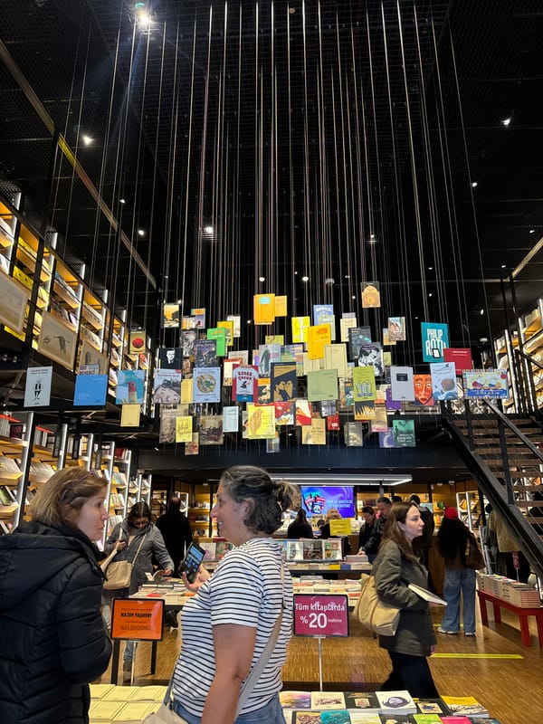 Two women observed together inside modern bookstore