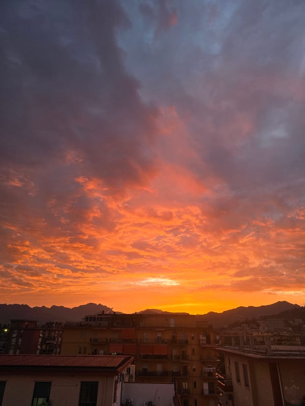 Salerno at golden hour — streets, hillsides, and a vivid sunset