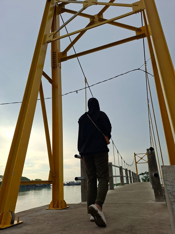 Person in black hijab visits multiple waterfront locations in Lhokseumawe