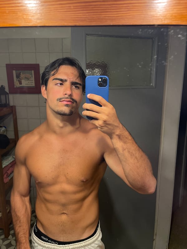 Man takes mirror selfie in Avellaneda, Argentina