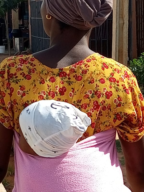 Everyday street life along a Tempure, Nigeria neighborhood