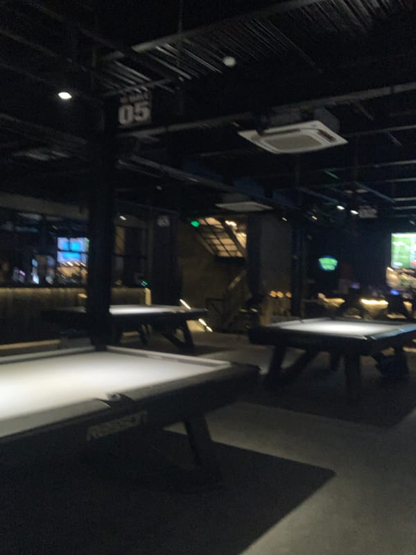 Bar interior captured in Đà Nẵng showing sports broadcasts