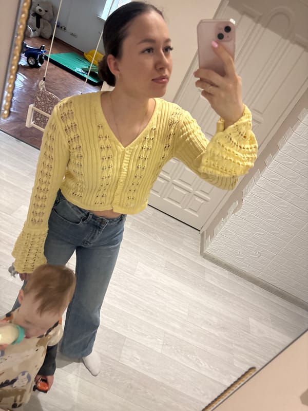 Mother and child take mirror selfies at home in Russia