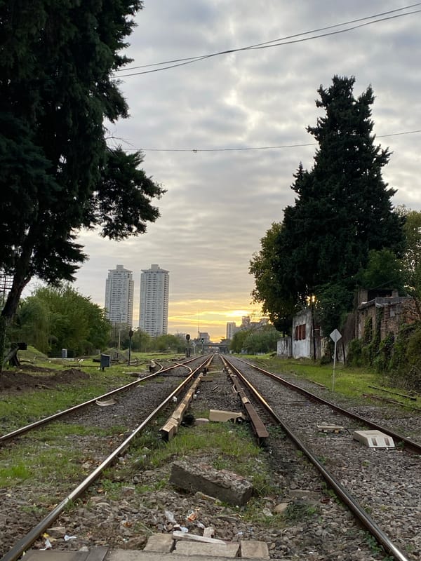 Railway tracks photographed during golden hour in Buenos Aires