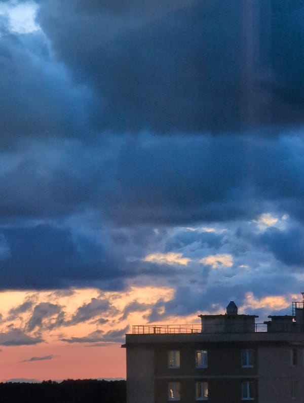 Storm clouds roll over Saint Petersburg apartment blocks at twilight