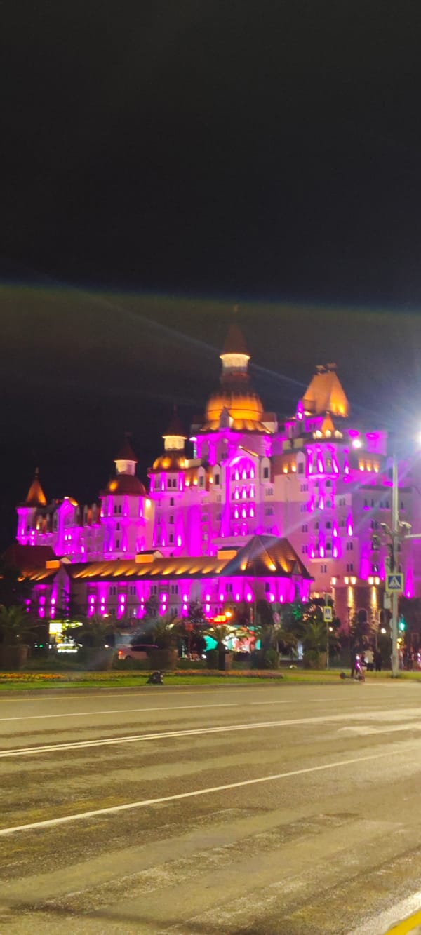 Colorful lights illuminate large building in Sirius, Russia