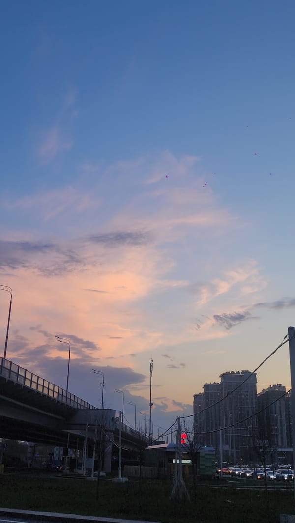 Moscow sunset observed over highway overpass and urban infrastructure