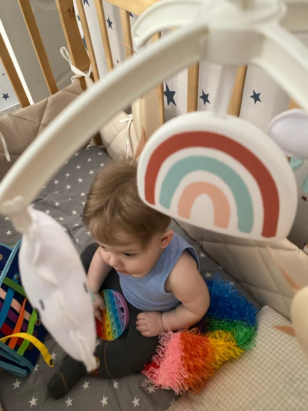 Toddler plays with fidget toy in Votkinsk nursery