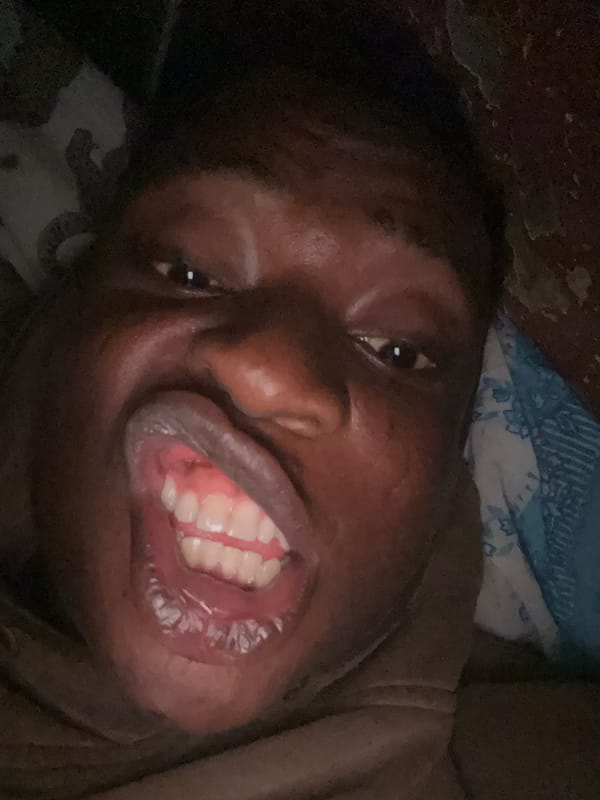 Person photographed resting in bed during late night hours