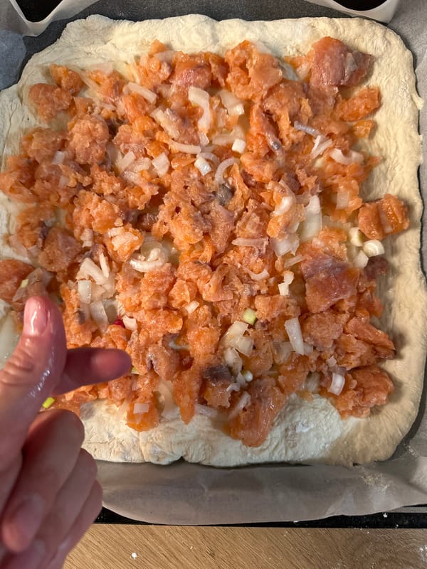 Woman prepares dough, shares meal with child in Fethiye