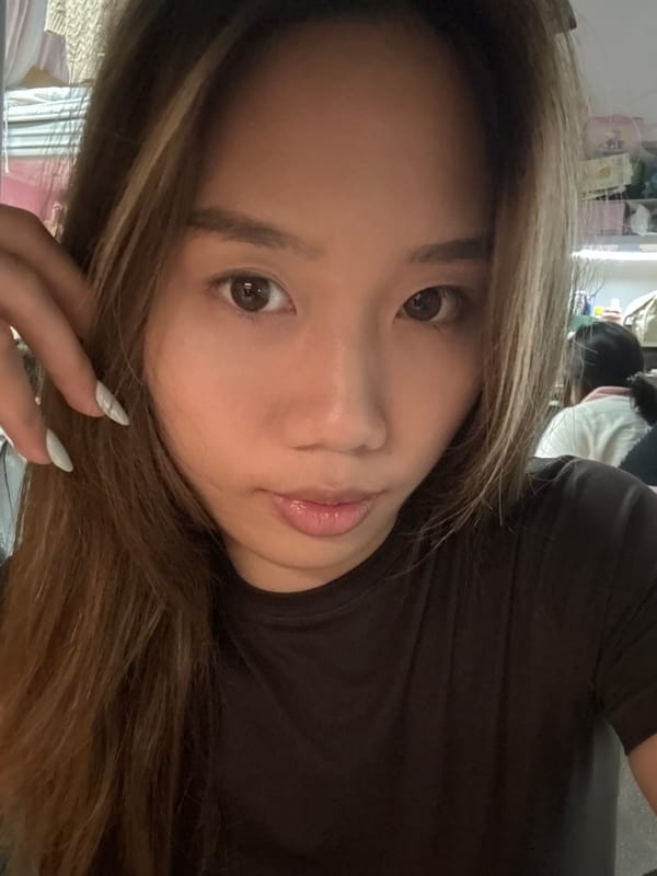 Woman takes selfie session in cluttered Chongqing room
