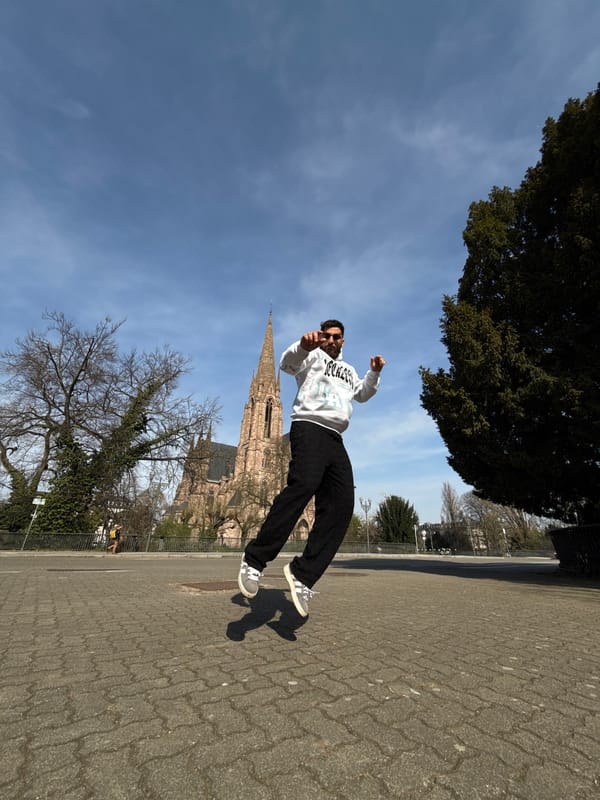 Spring day tourists explore Strasbourg's Ill River near Saint-Paul Church