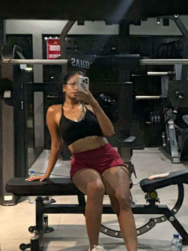 Woman takes gym selfies at Batubulan fitness center