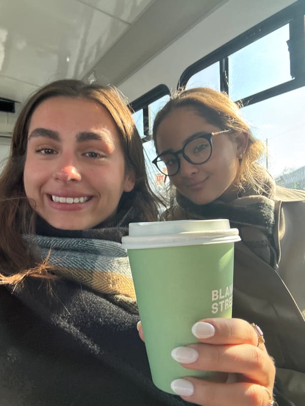 Two women take selfie on public transit in Belmont