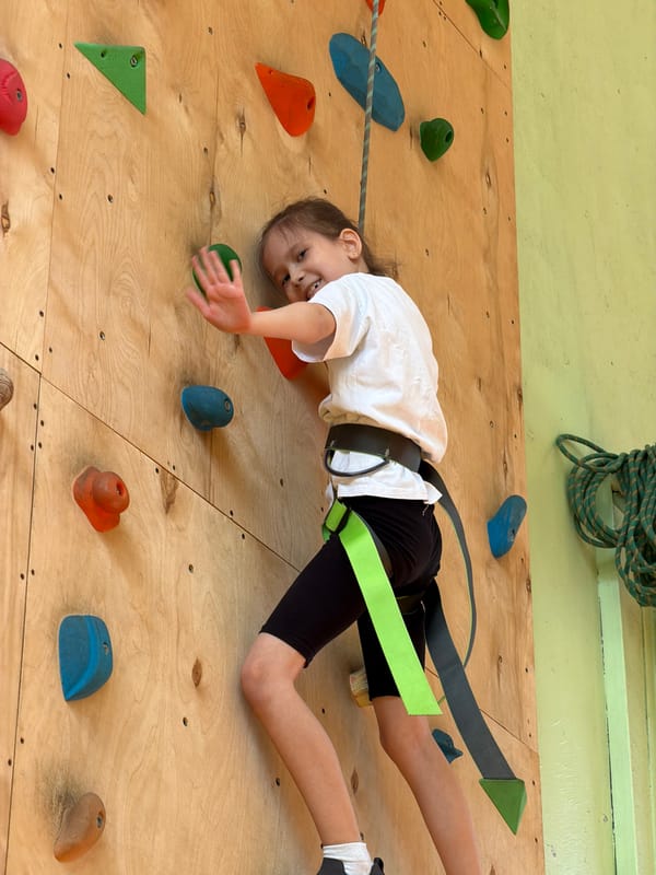 Young climbers practice indoor rock climbing in Izhevsk