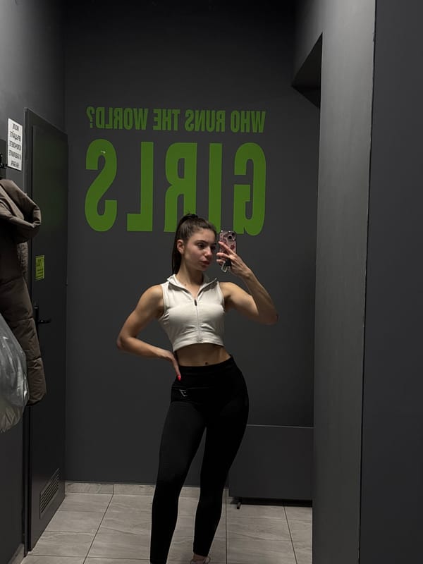 Woman takes workout selfies at gym facility