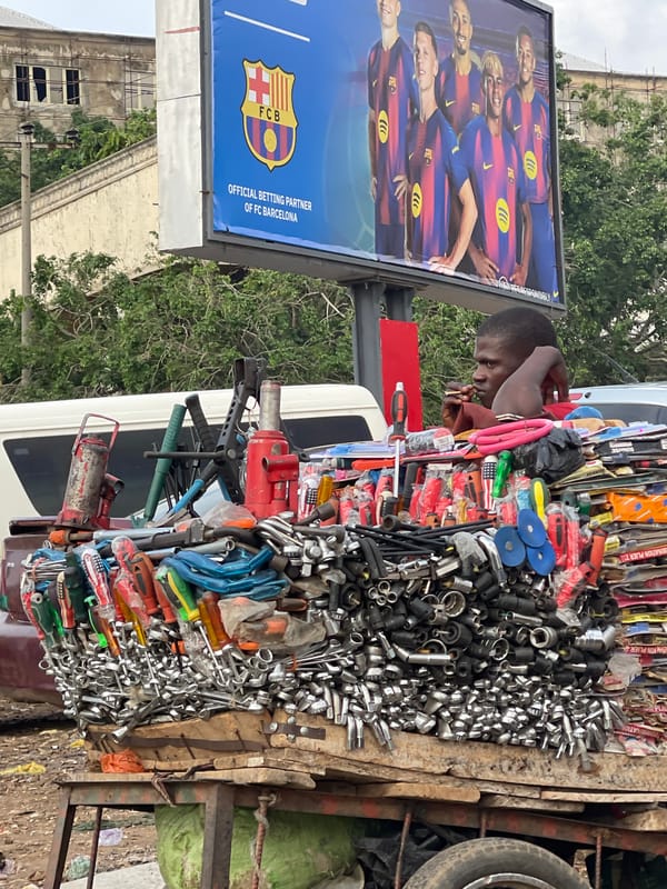 Street commerce and daily movement in central Abuja
