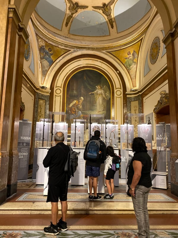 Visitor documents ornate cathedral interior in Buenos Aires