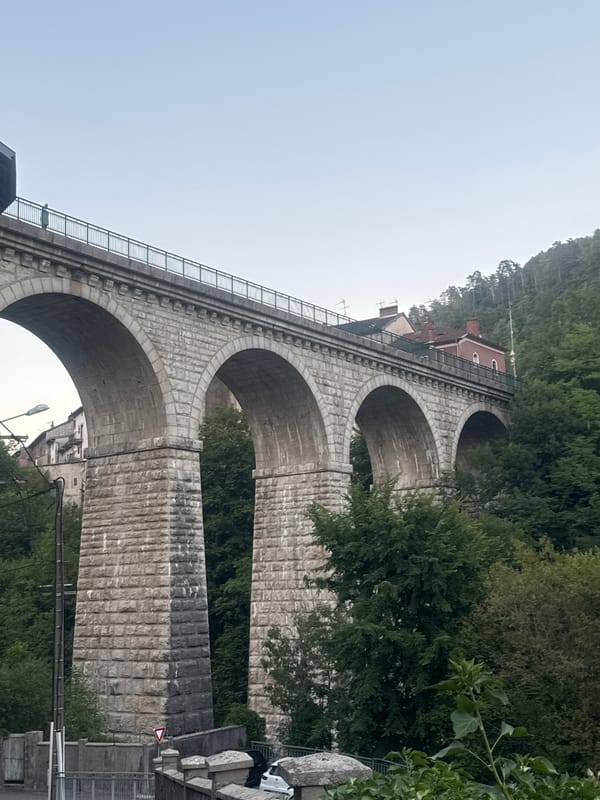 Saint-Claude's historic stone viaduct, buildings perched on top