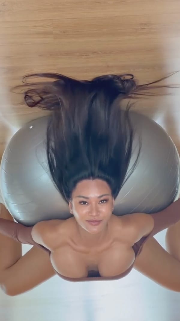 Stability ball stretch on a wooden floor in Moscow