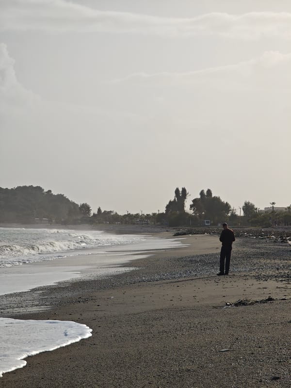 Lone visitor watches waves break on Demre beach