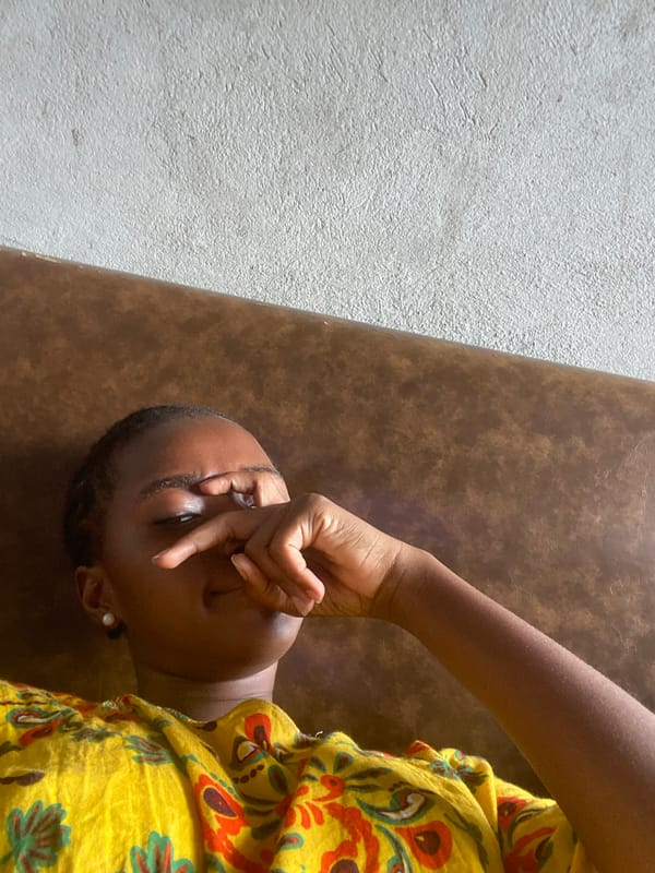 Woman rests at home in Dar es Salaam morning scene