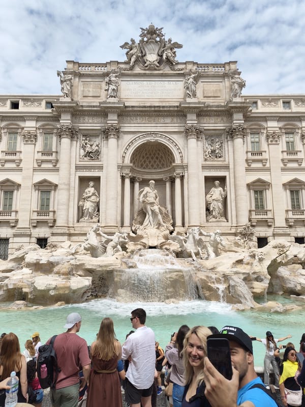 Tourists gather at Rome's Trevi Fountain during morning hours