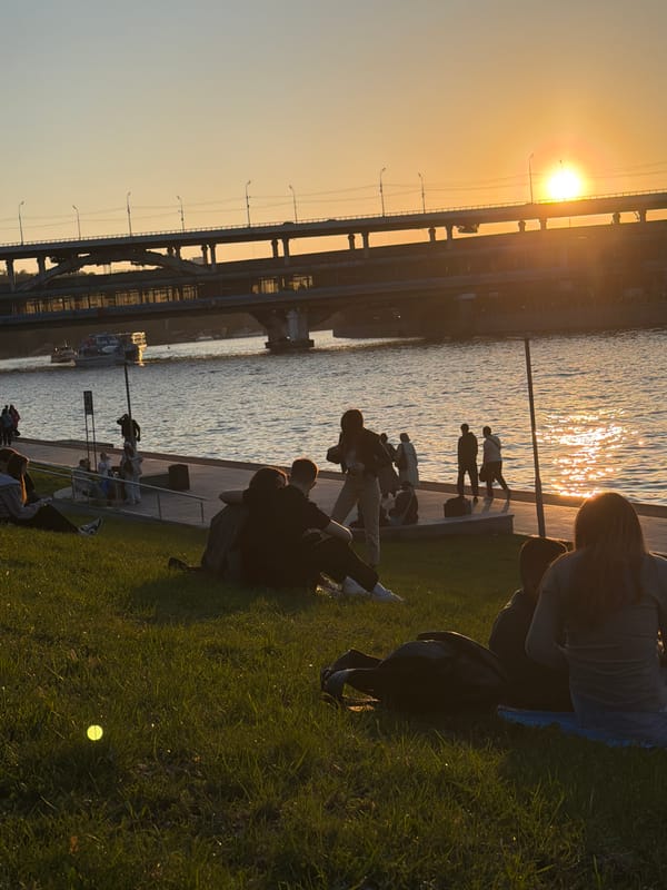Evening riverside gathering in Moscow draws residents during golden hour