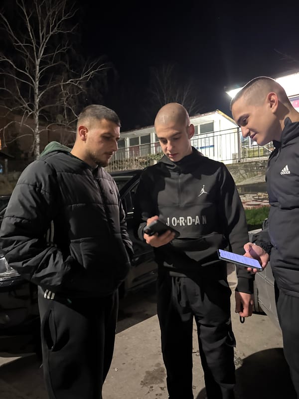Young men take casual photos outdoors in Topoli Bulgaria