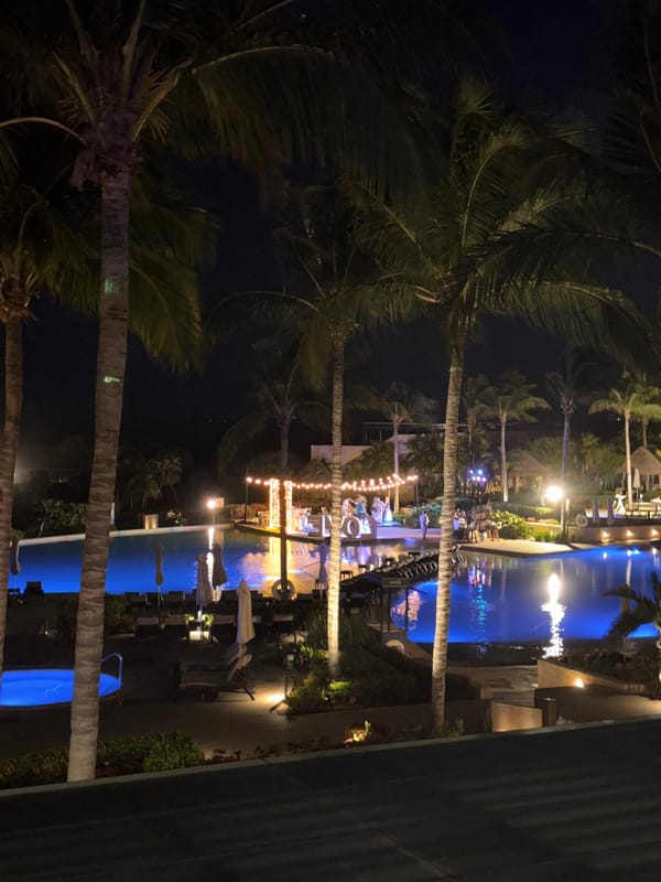 Late-night resort stay in Punta Sam with dining, drinks, and pool views