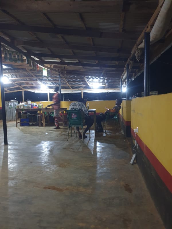 Evening social gathering documented at outdoor venue in Nigeria