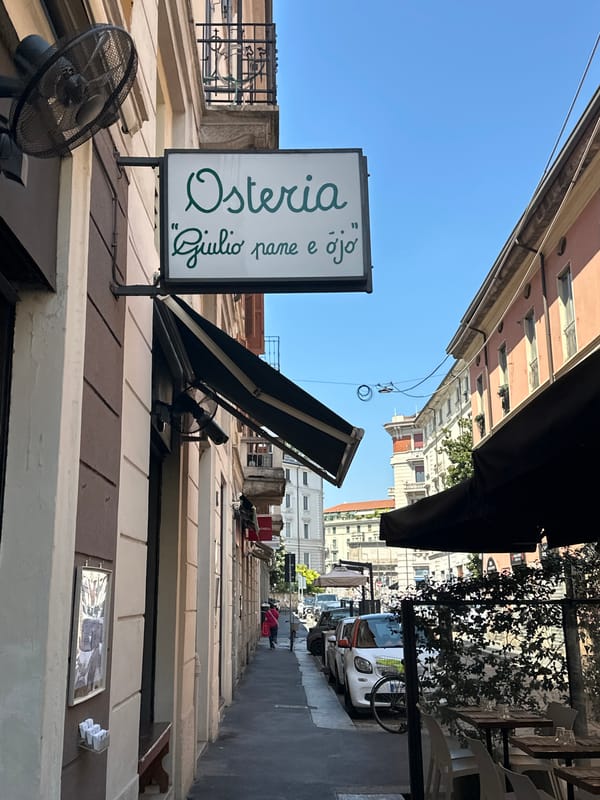 Milan architecture and street life on a bright summer morning