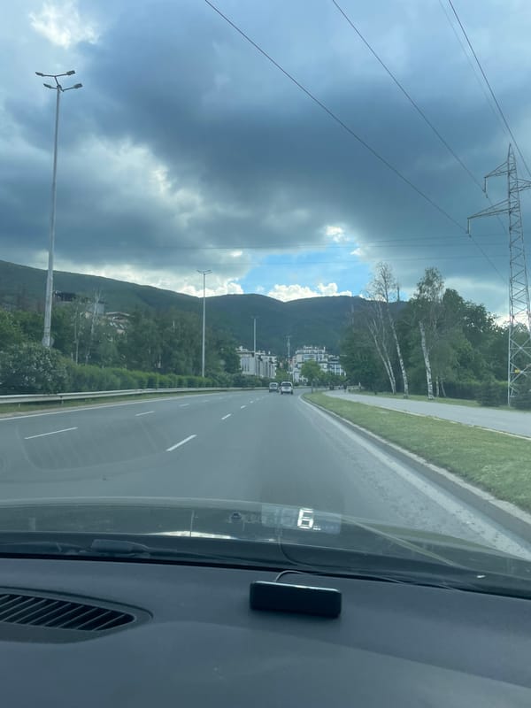 Highway journey through mountainous terrain captured in sequence