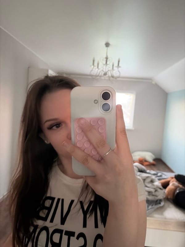 Woman takes multiple mirror selfies in Semyonov, Russia bedroom