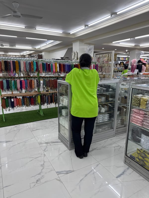 Customer shops in Kuta retail store during morning hours