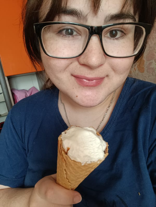 Child draws with orange marker in Noviy, Russia