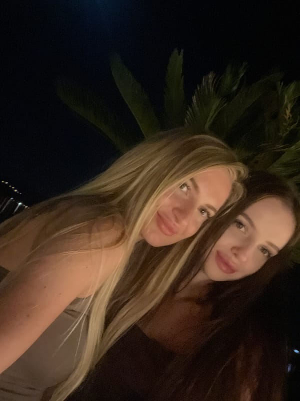 Women dine at outdoor restaurant in Tivat, Montenegro