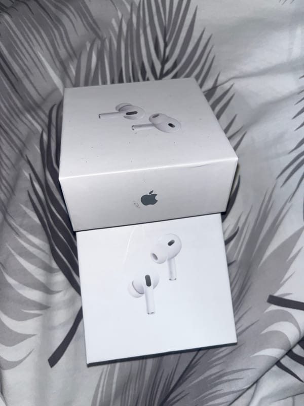 Apple AirPods Pro boxes spotted on patterned fabric in Laval