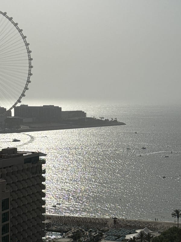 Afternoon at a Dubai beach resort with jewelry and coastal views