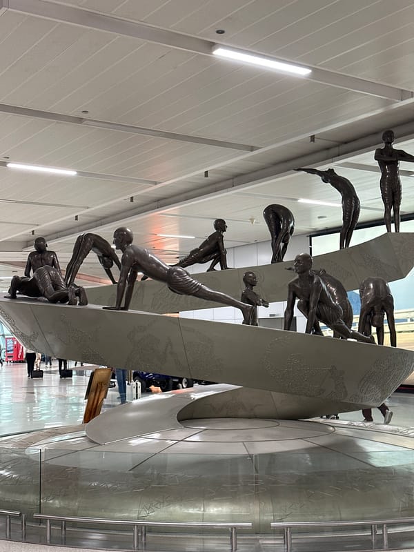 Bronze sculpture installation observed at New Delhi airport terminal