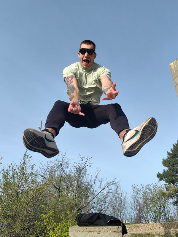 Man captured jumping against blue sky in Varna, Bulgaria