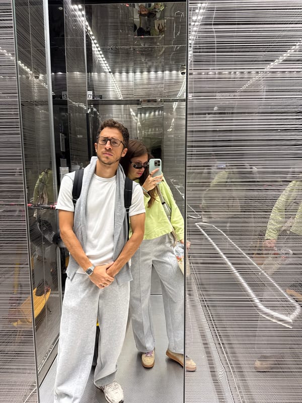Couple takes mirror selfie in Ramat Gan building