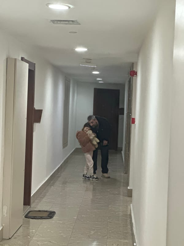 Child enjoys tablet time and fidget toys at home