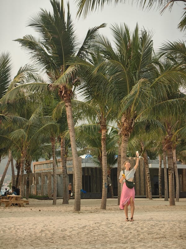 Beachgoers swim, photograph at Bai Chay Ward Vietnam morning