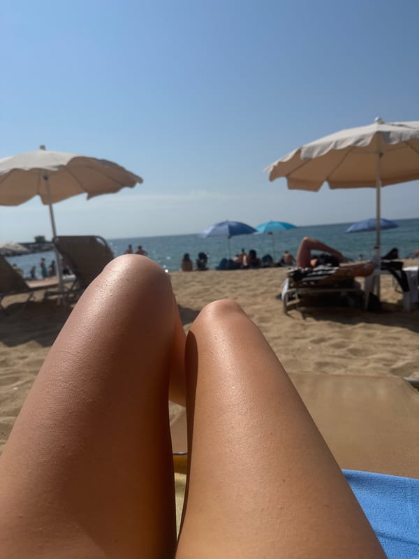Lazy beach morning at Barceloneta with coastal path views