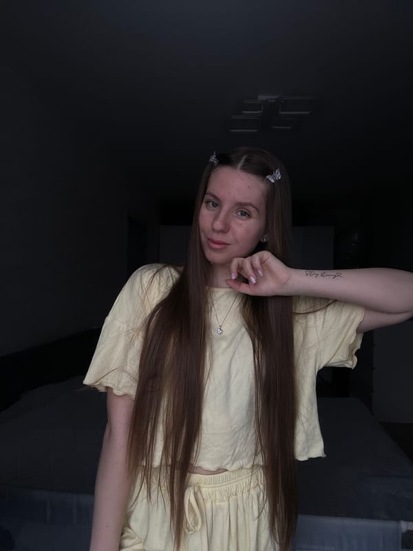 Woman photographed in bedroom setting in Klin, Russia