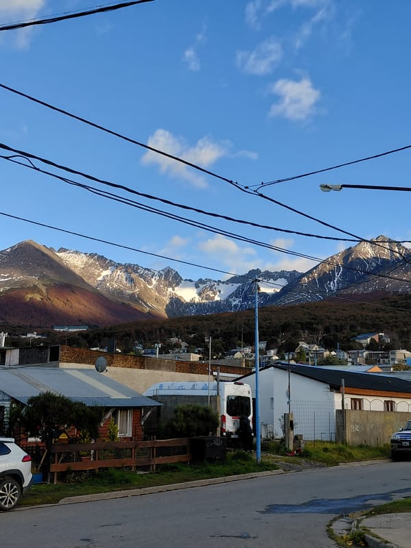 Street scene captured in Ushuaia with mountain backdrop