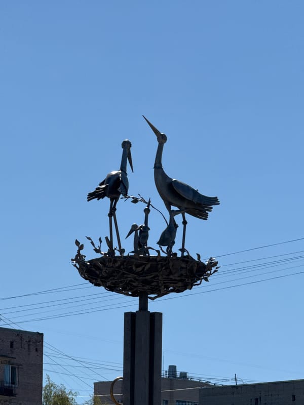 Morning scenes documented across Vsevolozhsk featuring sculptures and street life