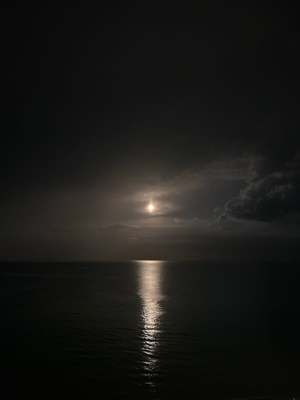 Nighttime waterfront scene captured in Nesebar, Bulgaria