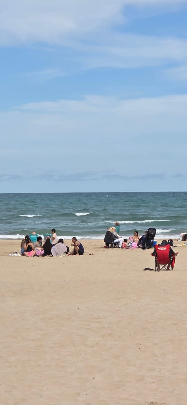 Beach activities captured along Sagunto coastline during afternoon hours
